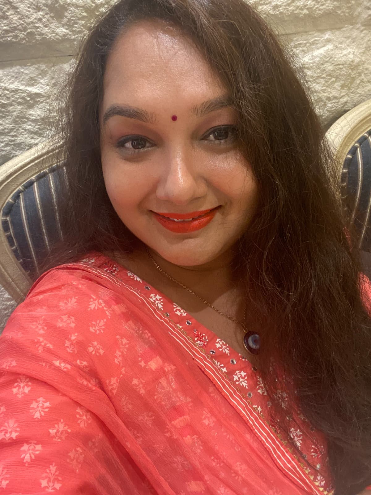 Dr. Devanu smiling warmly